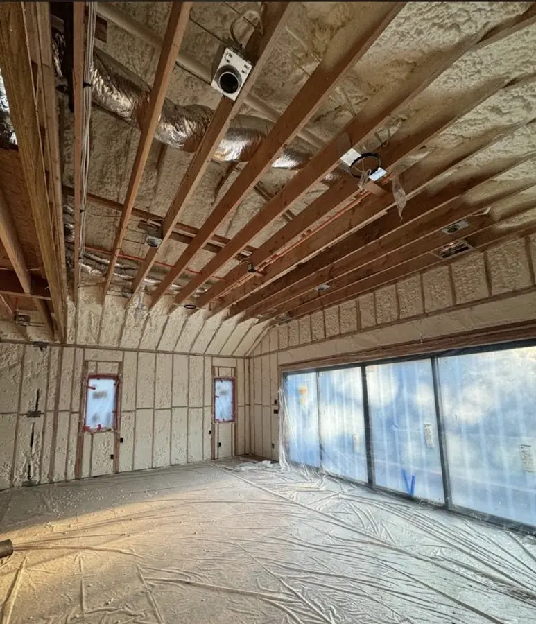 Interior walls and ceiling insulated with spray foam during new construction in Camden